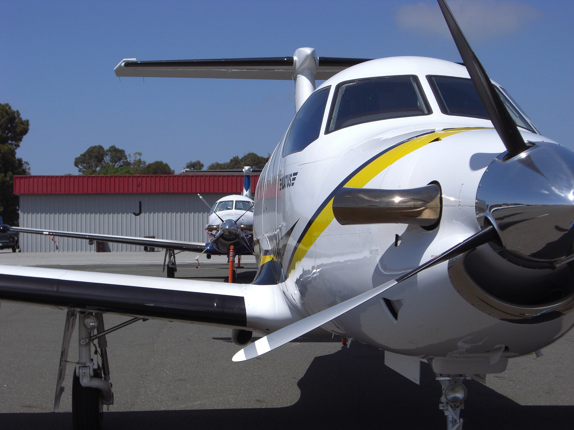 Pilatus PC-12 aircraft parked on an airport ramp