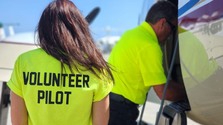 Volunteer Pilot Group team loading an aircraft